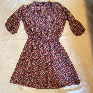 Light weight floral dress with elastic waist.